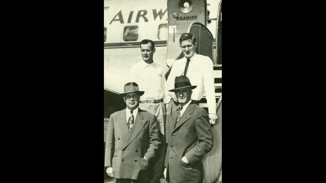 University of Texas team boarding a plane to New Orleans to play the University of Alabama in the Sugar Bowl on January 1, 1948, Tom Landry, punter (back left)