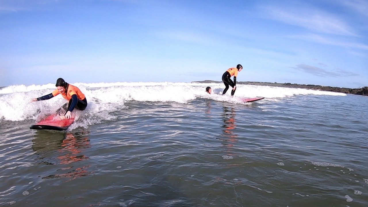 Two students surfing on the same wave - Offshore Surf School Inverloch 
