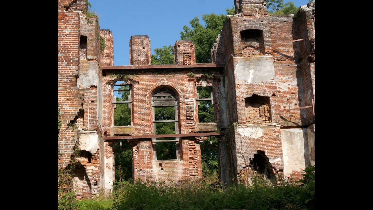 Wall with fireplaces and large window opening