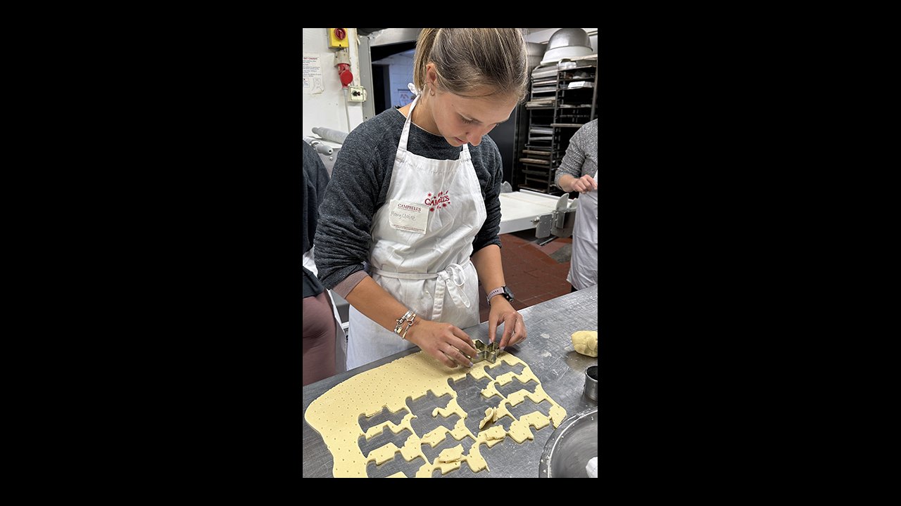 Cutting shortbread shapes on the bakers' large table