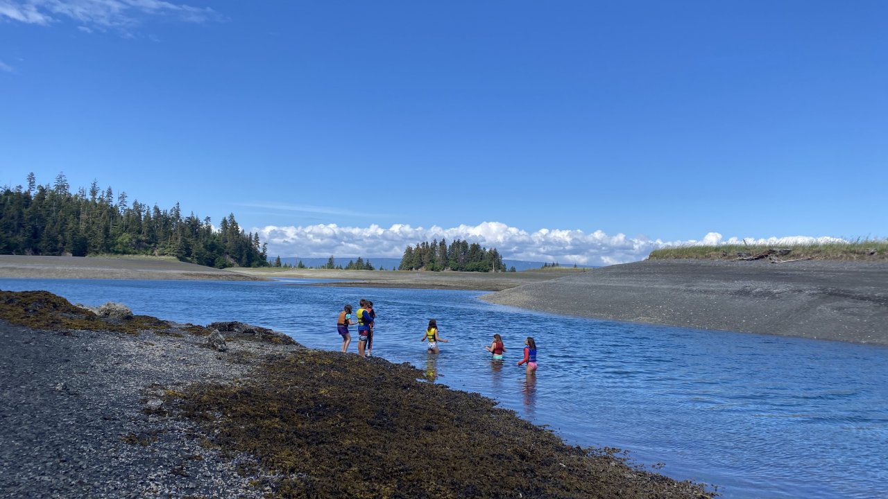 Campers swimming in the Peterson Bay lagoon.