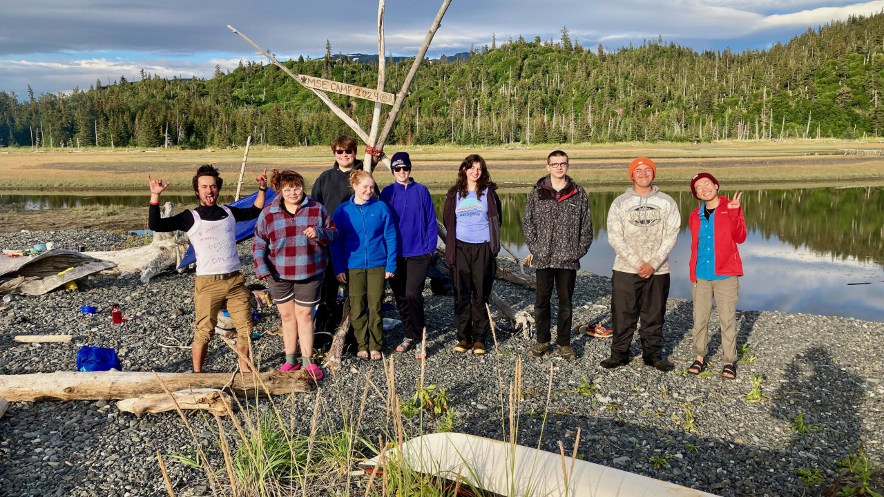 Participants posing for a photo at one of their campsites.