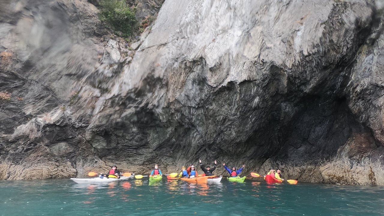 Participants among the dramatic cliffs of Kachemak Bay.