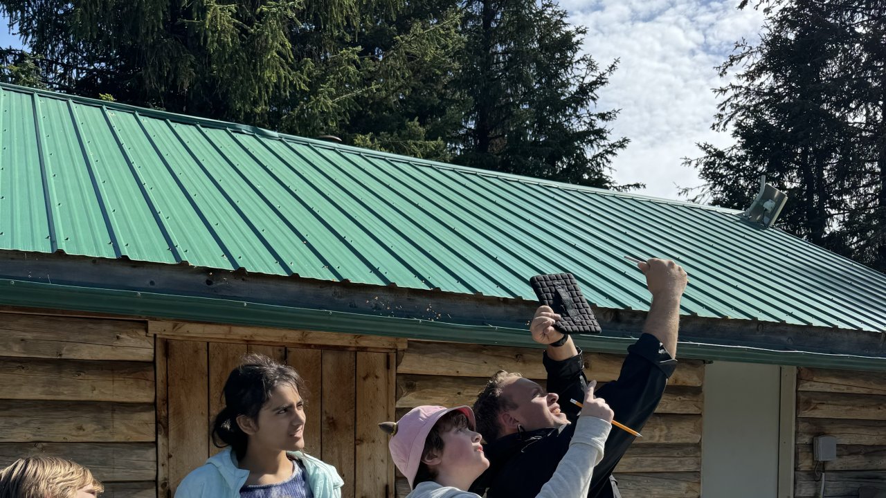 An educator gives a lesson about meteorology.