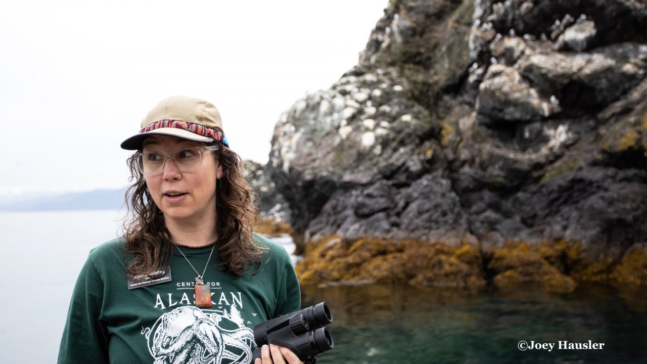 Naturalist presenting interpretive information at Gull Island. Photo by Joey Hausler.
