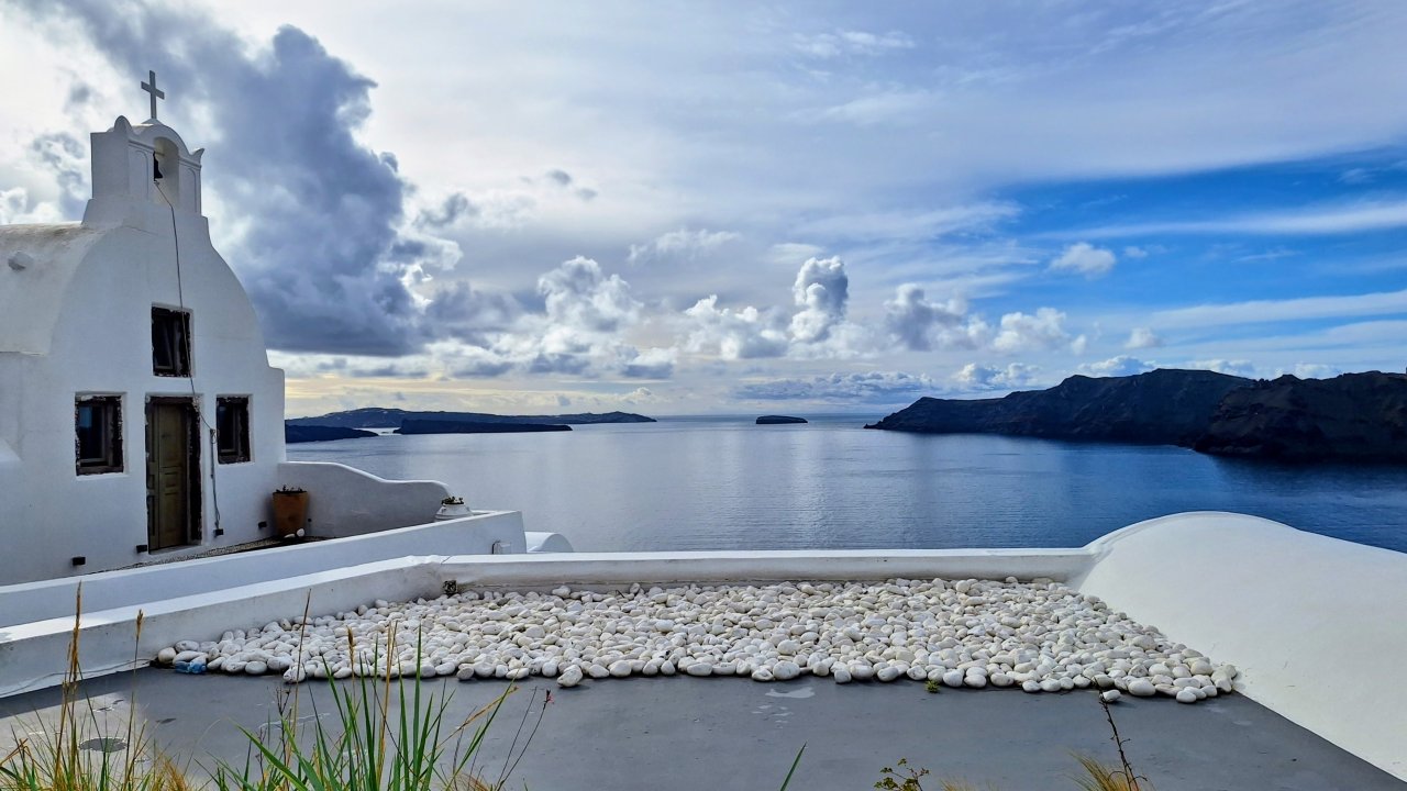 Oia village cliffs during 7-hour private Santorini tour, fully accessible in this part