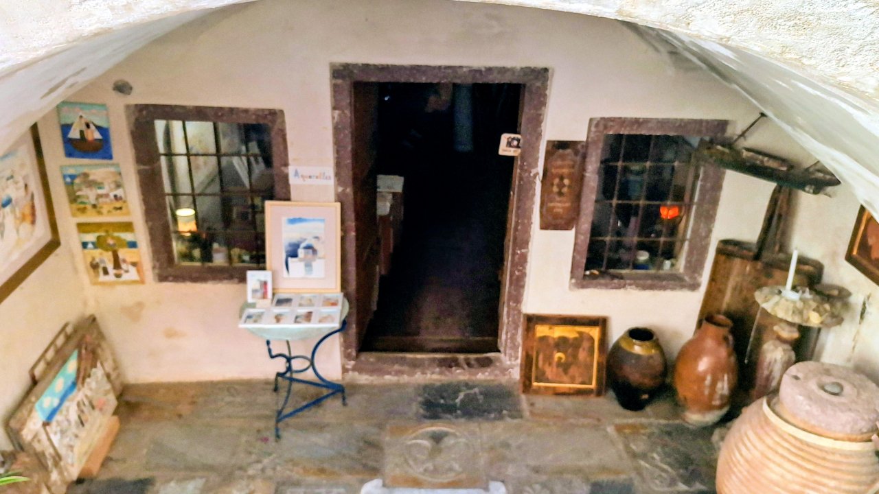 Traditional icon painter's workshop in an old cave house, Oia
