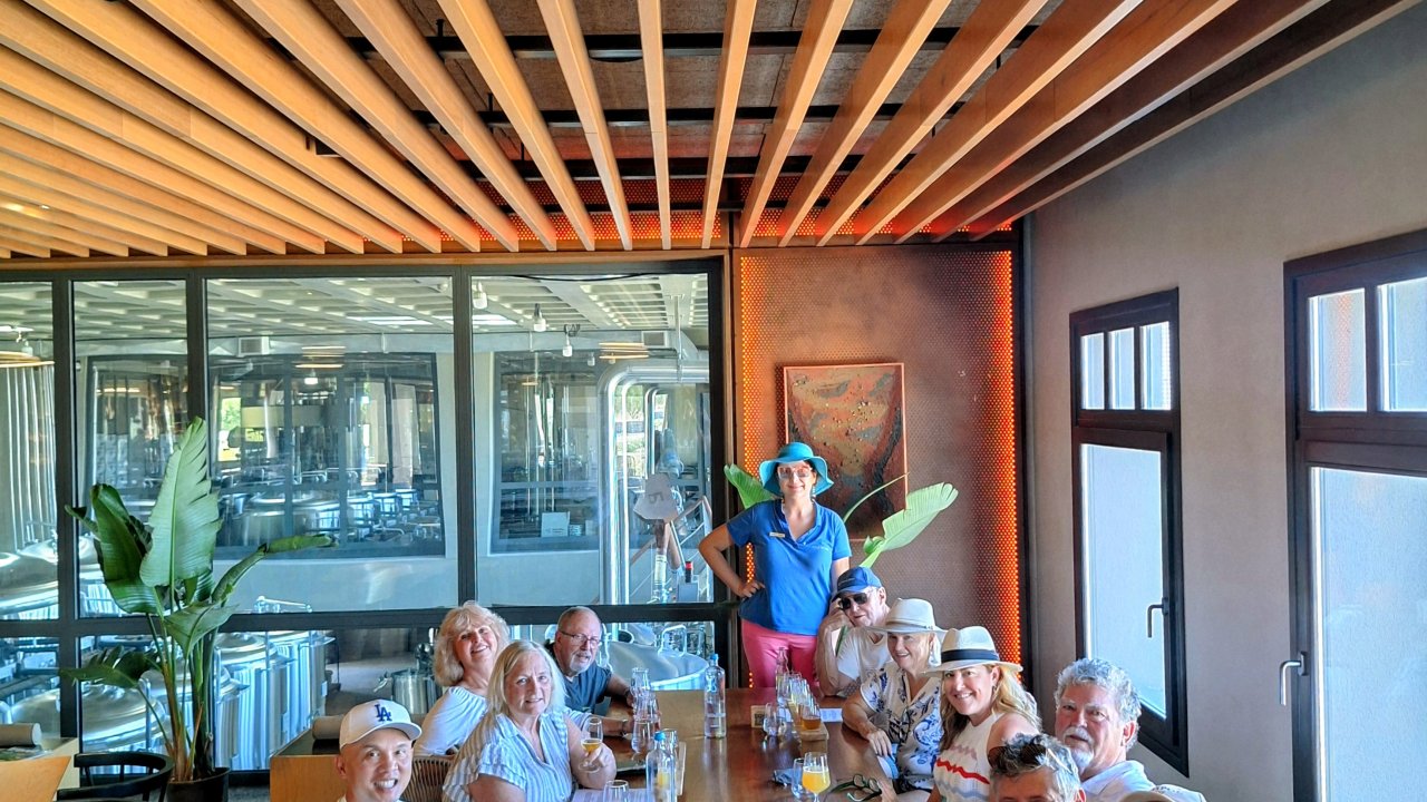 Seated FTELOS brewery stop during private Santorini tour